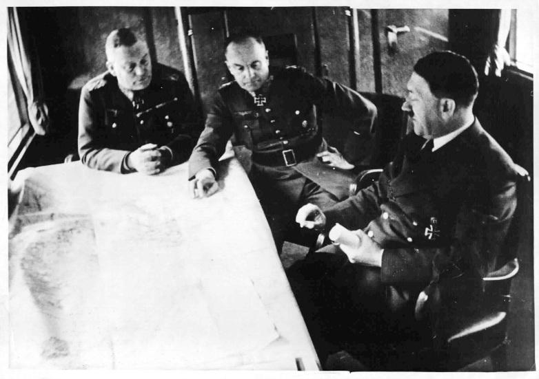 Adolf Hitler during a situation conference with general Keitel and general von Brauchitsch in Führerhauptquartier Frühlingssturm, Hitler's special train